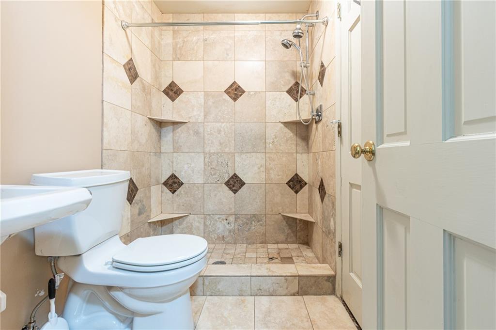 4765 Paran Valley Northwest Atlanta, GA 30327 - Photo 61 of 61 a bathroom with a toilet and shower