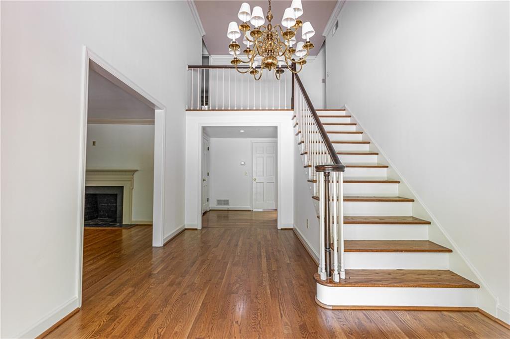 4765 Paran Valley Northwest Atlanta, GA 30327 - Photo 7 of 61 a view of a hallway with wooden floor and staircase