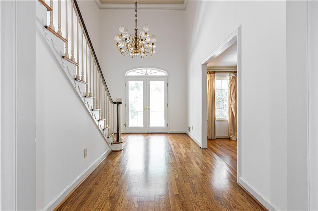 4765 Paran Valley Northwest Atlanta, GA 30327 - Photo 8 of 61 a view of a hallway with wooden floor and staircase