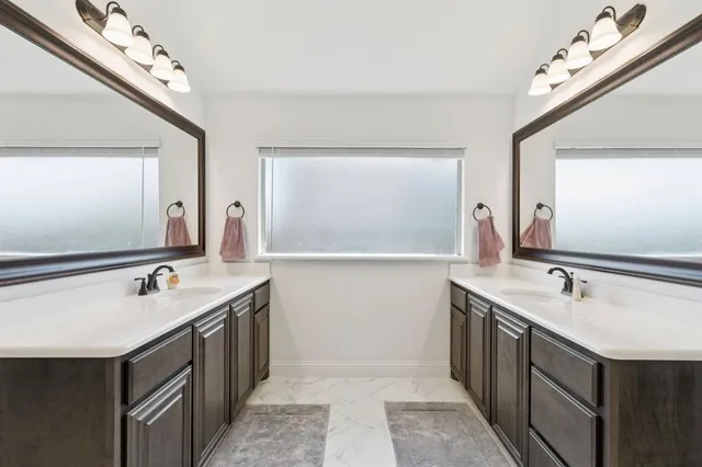 a bathroom with a bathtub and a sink
