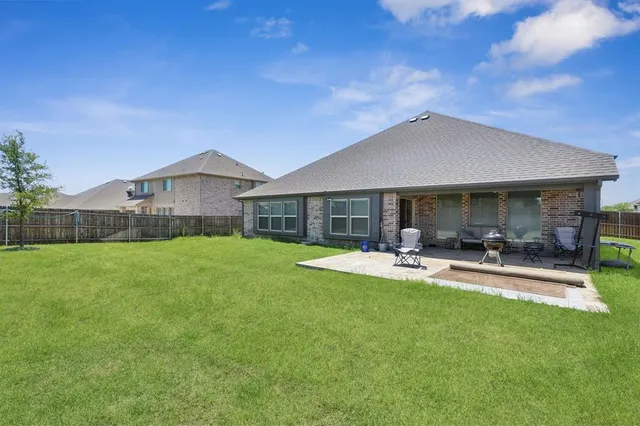 an aerial view of a house with outdoor space