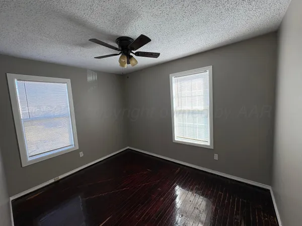 a view of empty room with windows