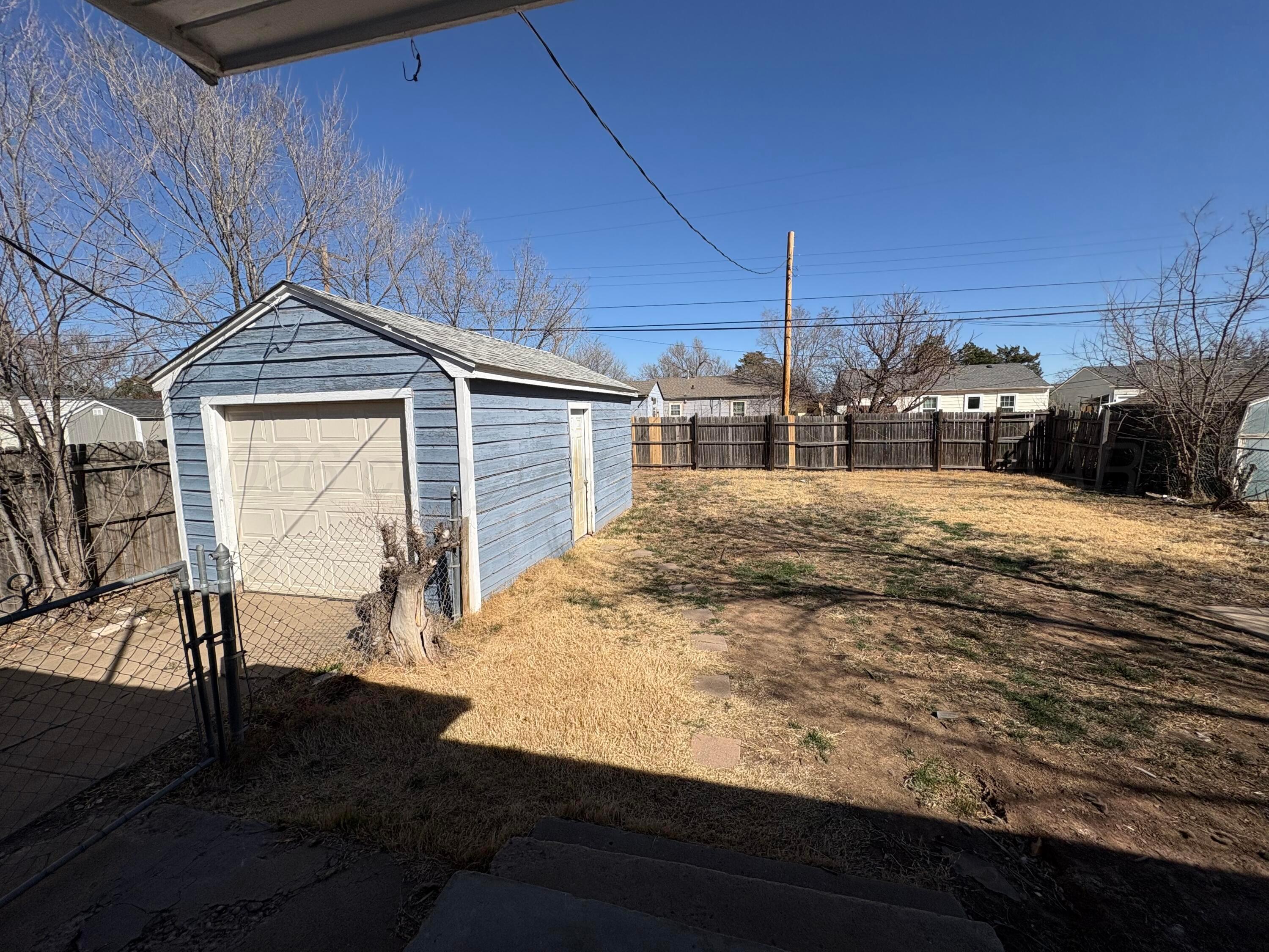 4119 Parker Street Amarillo, TX 79110 - Photo 8 of 8 a view of a backyard of the house