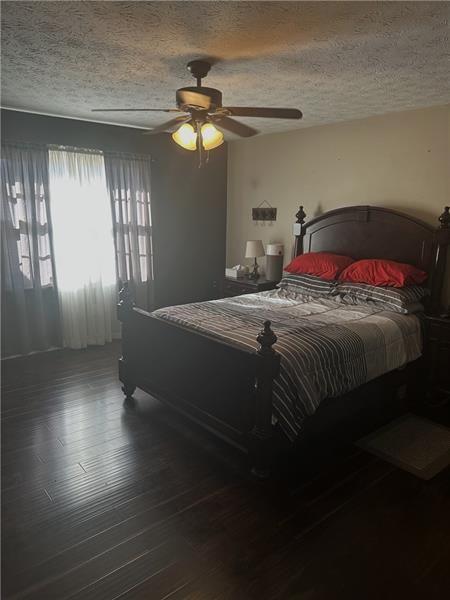 10 Dial Road Monroe, GA 30655 - Photo 7 of 13 a bedroom with a bed and a chandelier
