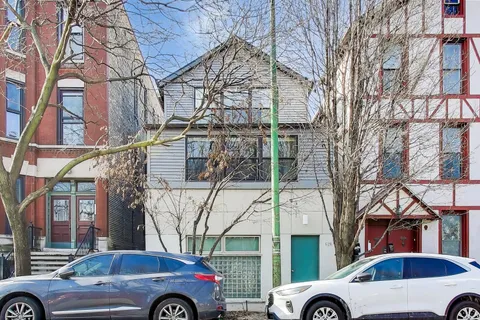 a front view of a building with parking space