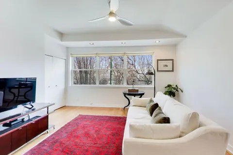 a bedroom with a bed and flat screen tv