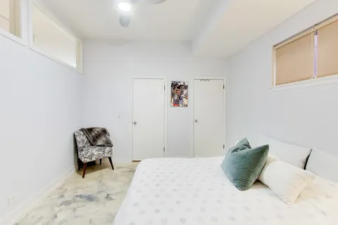a bathroom with a double vanity sink mirror and shower