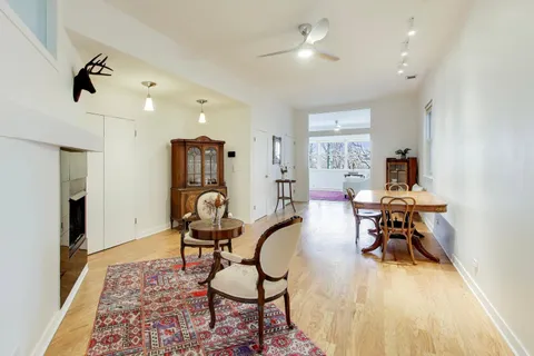 a view of a kitchen with a sink cabinets and wooden floor