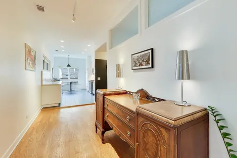 a kitchen with stainless steel appliances a stove a sink and a refrigerator