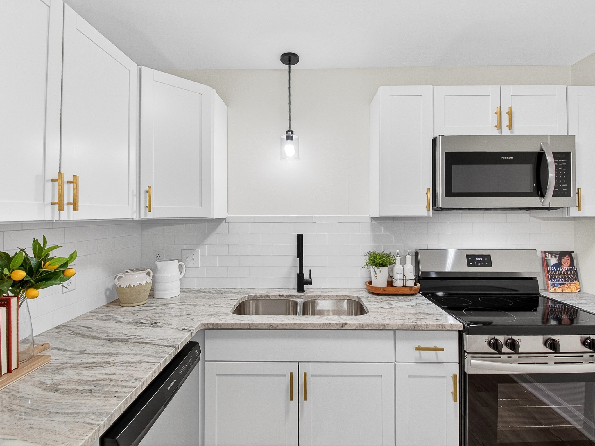 159 Hicks Road Nashville, TN 37221 - Photo 16 of 46 a kitchen with appliances a sink and cabinets