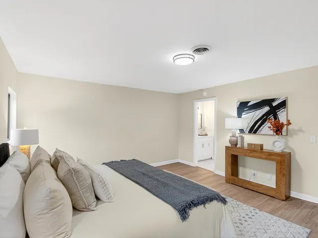 a bedroom with a bed and a fireplace