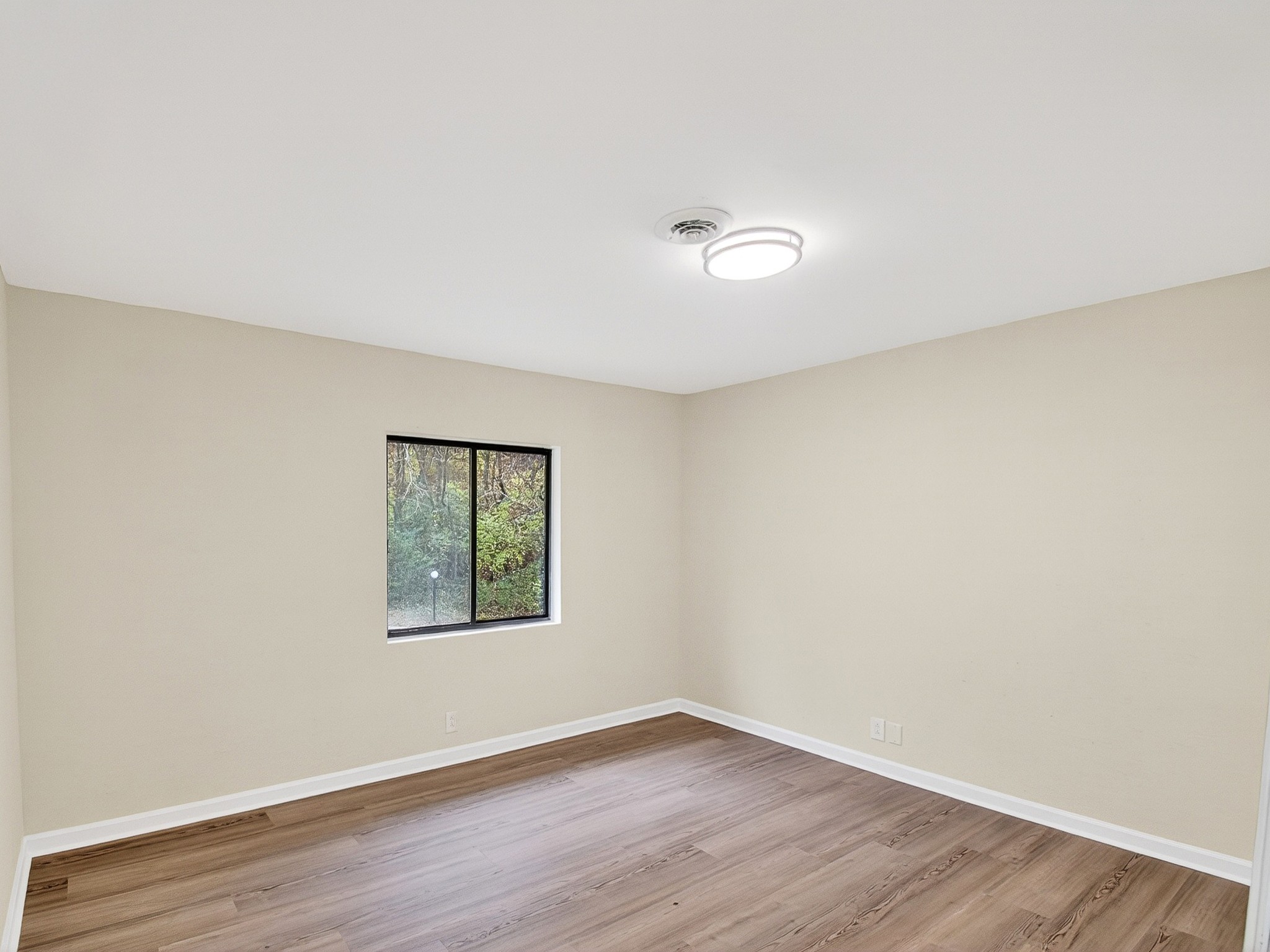 159 Hicks Road Nashville, TN 37221 - Photo 35 of 46 an empty room with wooden floor and windows