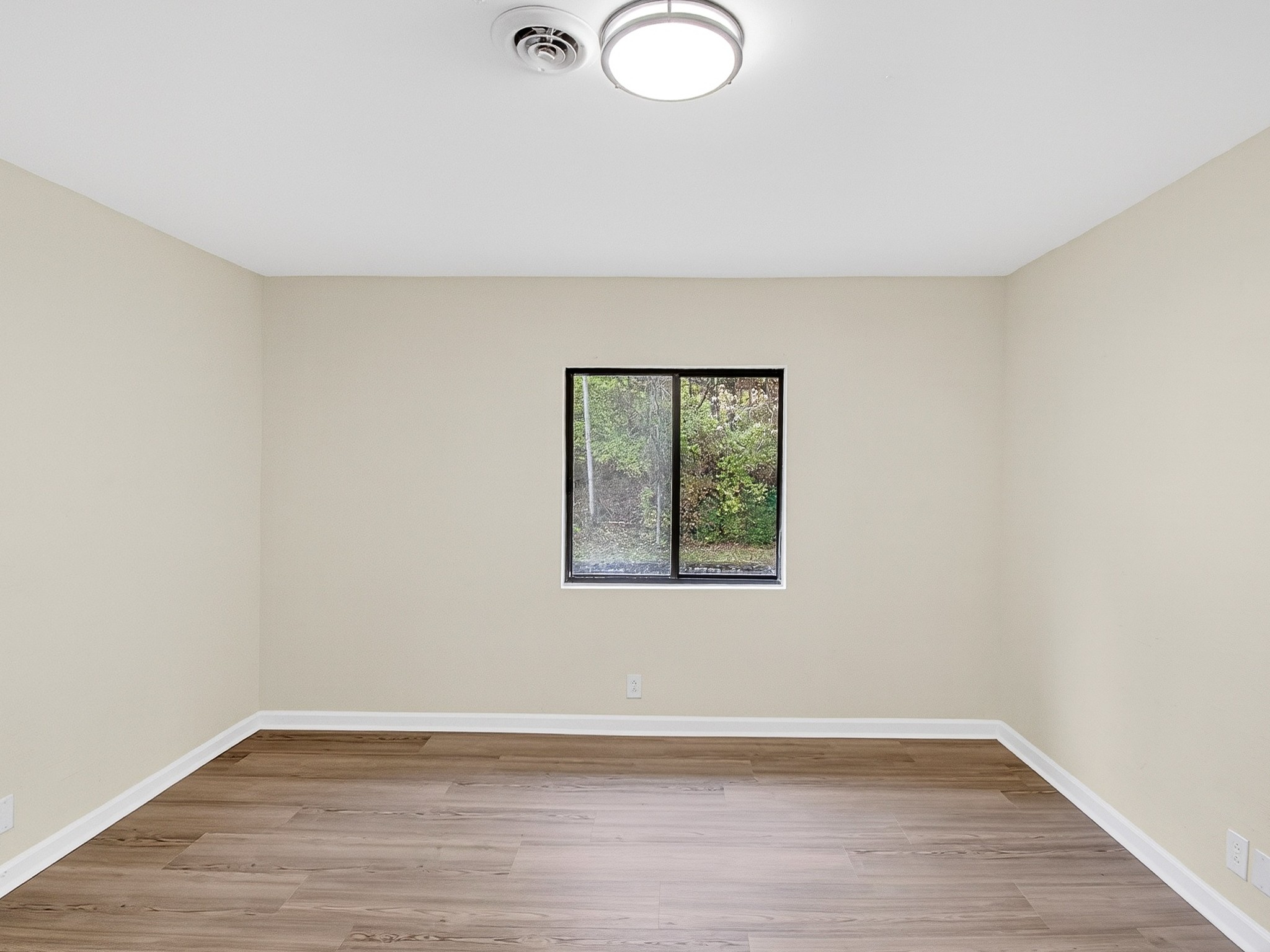 159 Hicks Road Nashville, TN 37221 - Photo 38 of 46 an empty room with wooden floor and windows