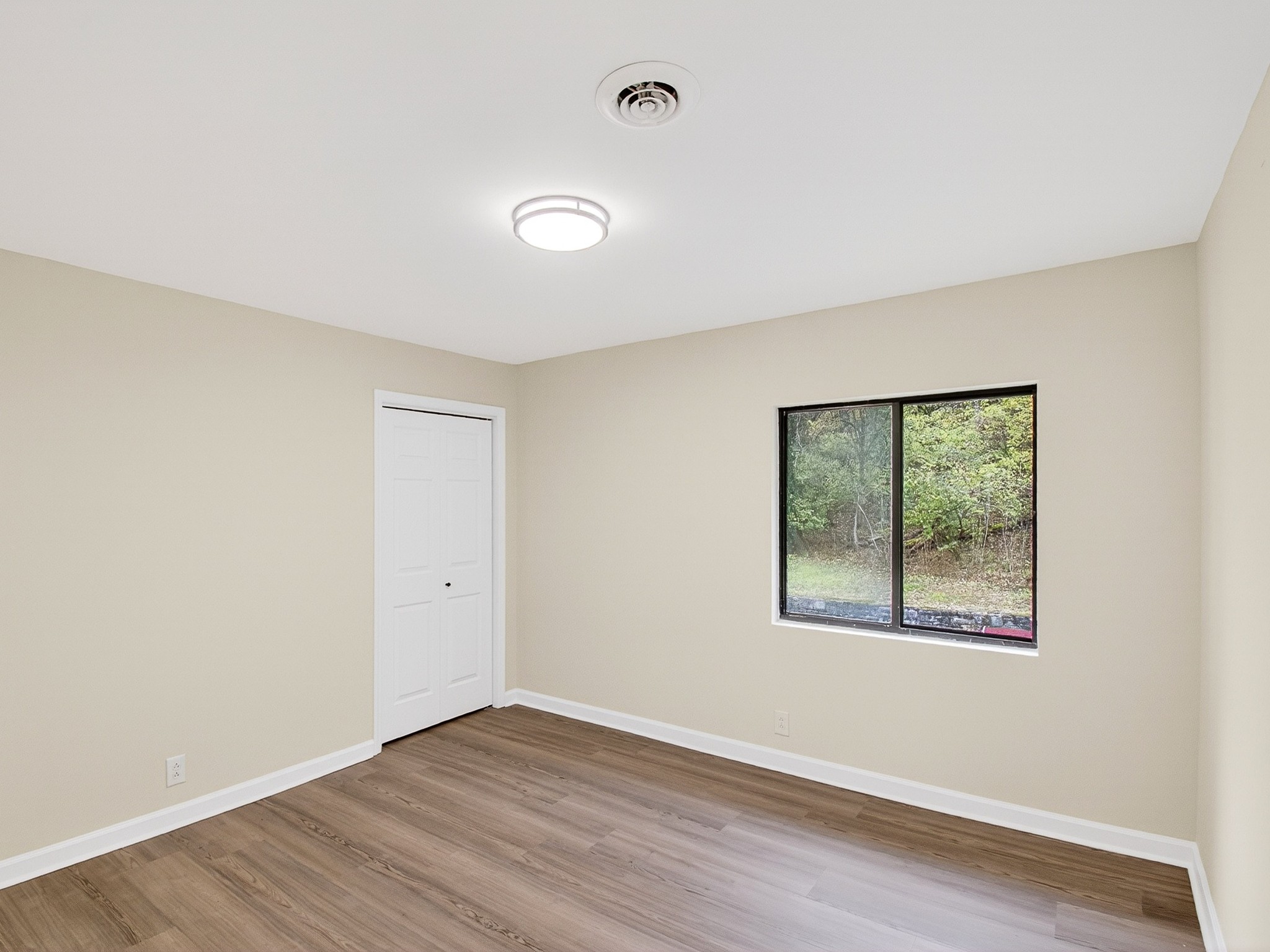 159 Hicks Road Nashville, TN 37221 - Photo 39 of 46 an empty room with wooden floor and windows