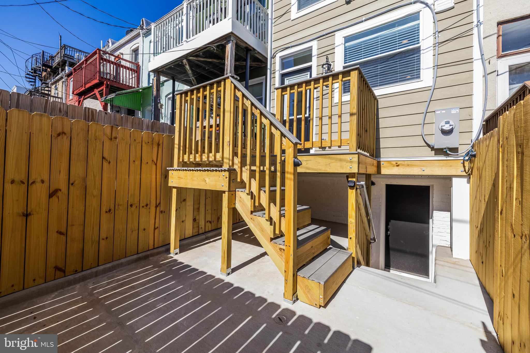 1317 Webster Street Baltimore, MD 21230 - Photo 15 of 32 a view of a house with wooden deck