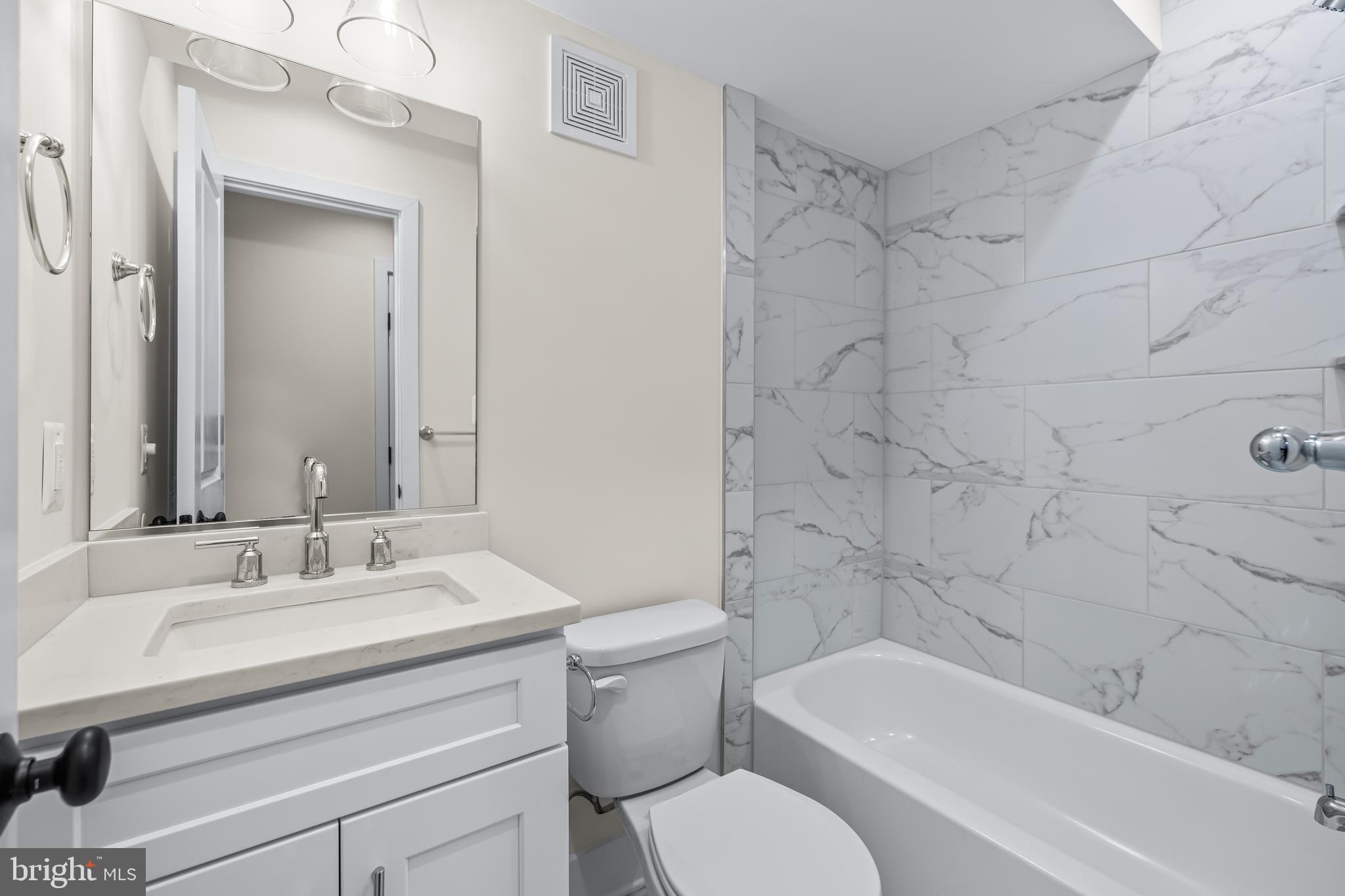 1317 Webster Street Baltimore, MD 21230 - Photo 30 of 32 a bathroom with a sink toilet and shower