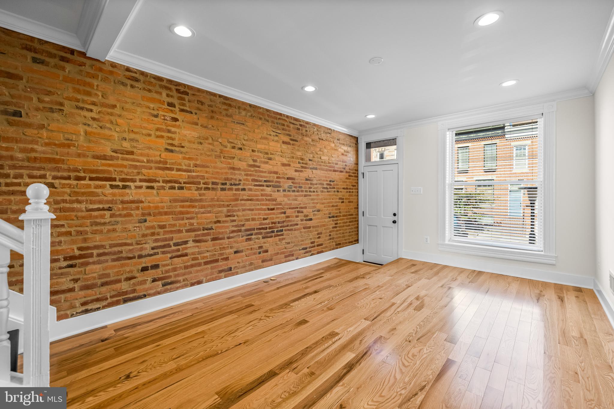 1317 Webster Street Baltimore, MD 21230 - Photo 5 of 32 a view of empty room with wooden floor and fan