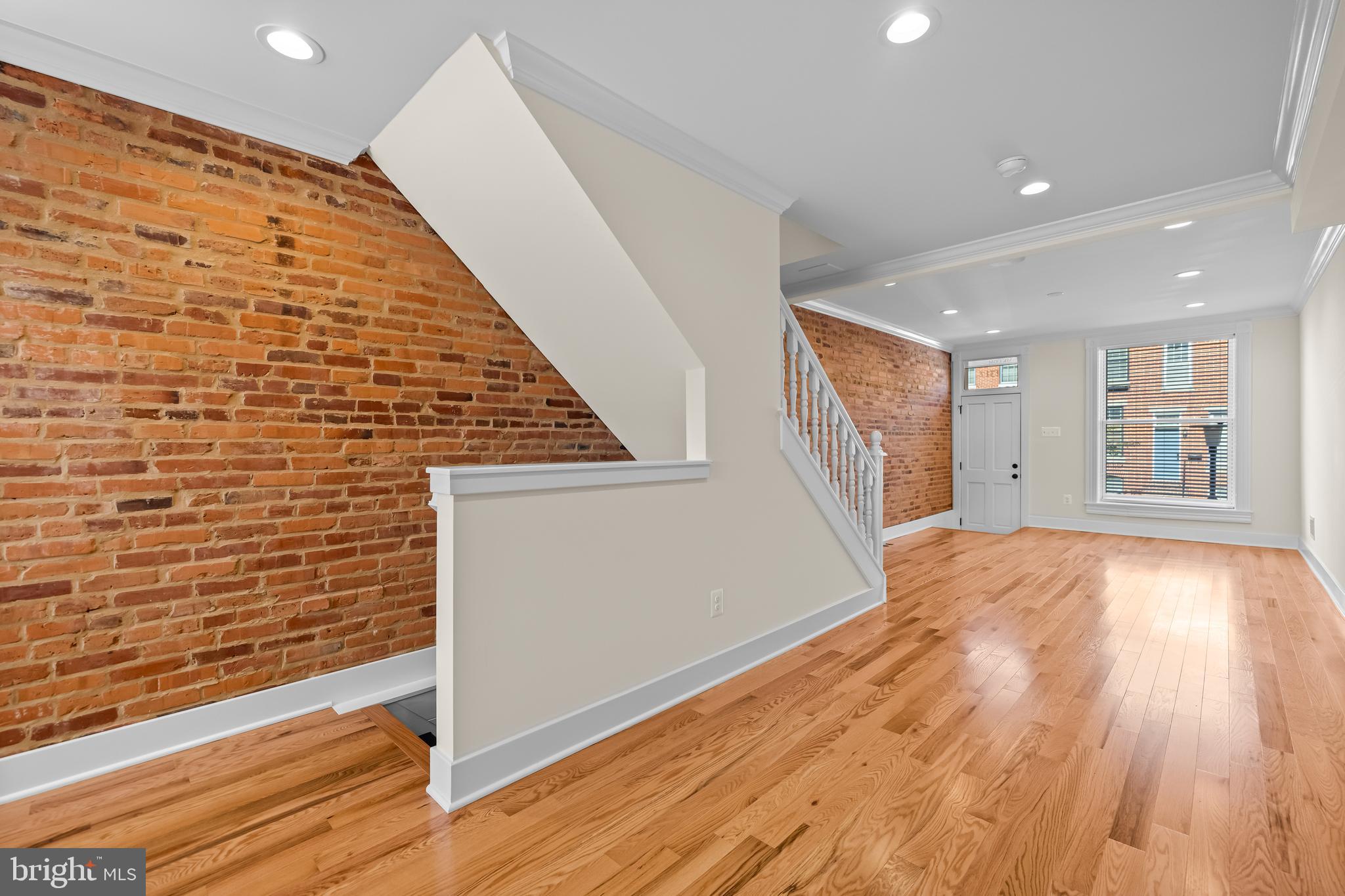 1317 Webster Street Baltimore, MD 21230 - Photo 8 of 32 a view of an empty room and wooden floor