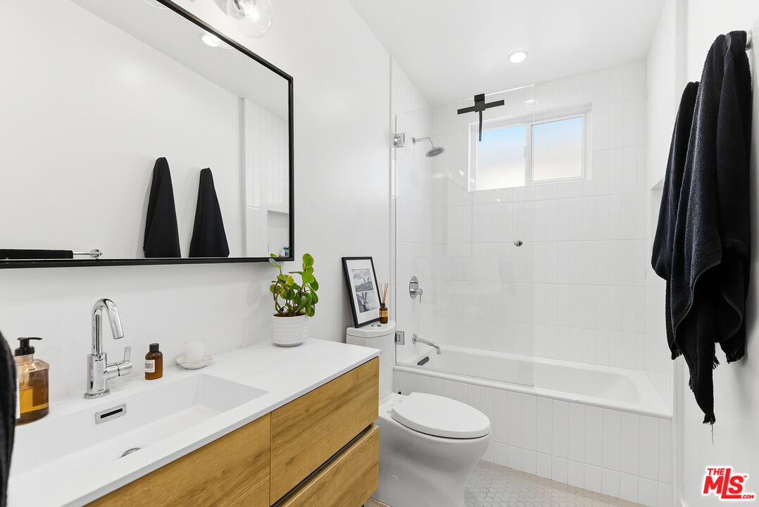2603 Abbot Kinney Boulevard, Unit 1/2 Venice, CA 90291 - Photo 14 of 16 a bathroom with a sink toilet and shower