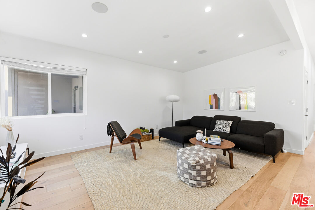 2603 Abbot Kinney Boulevard, Unit 1/2 Venice, CA 90291 - Photo 2 of 16 a living room with furniture and wooden floor