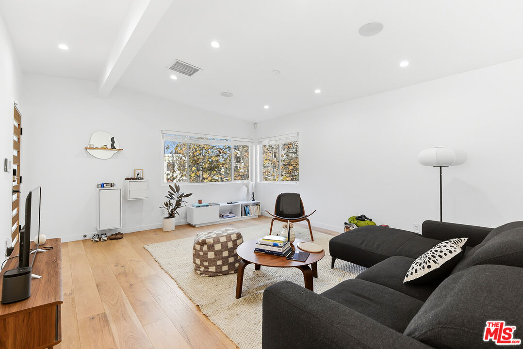 2603 Abbot Kinney Boulevard, Unit 1/2 Venice, CA 90291 - Photo 3 of 16 a living room with furniture and a flat screen tv