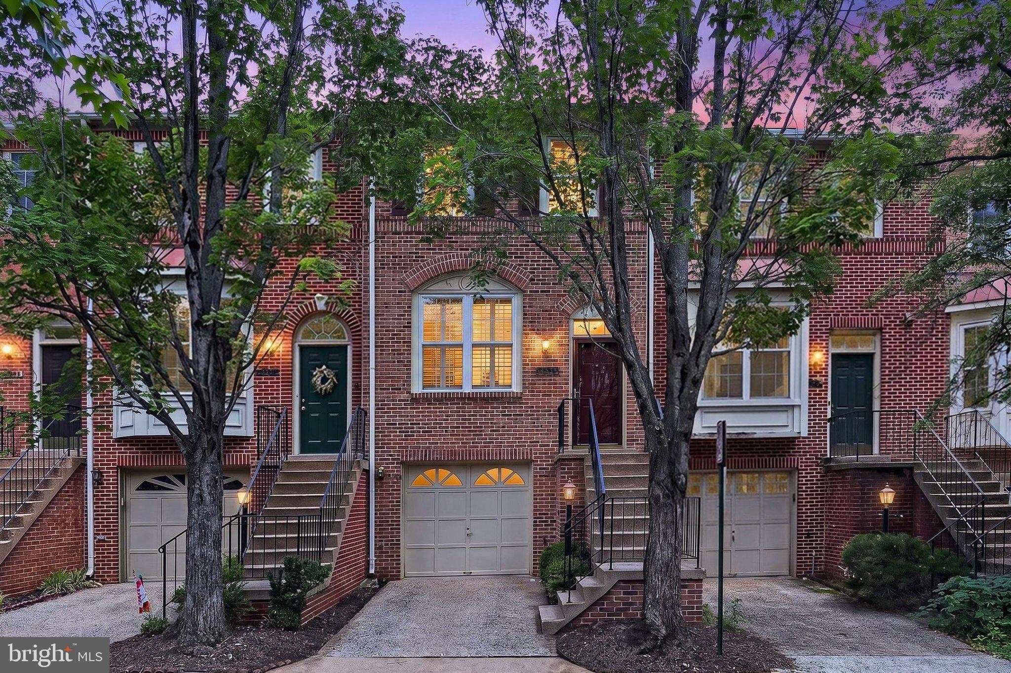 13157 Kidwell Field Road Herndon, VA 20171 - Photo 2 of 50 Charming brick townhomes at dusk.