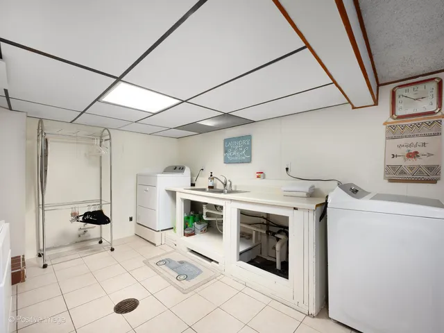 a view of kitchen sink and refrigerator