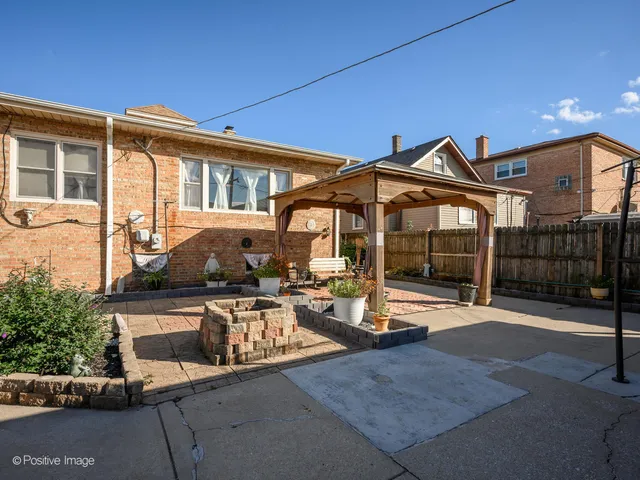a view of a house with sitting area and garden