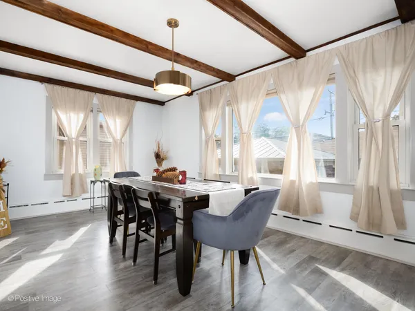 a view of a dining room with furniture window and outside view