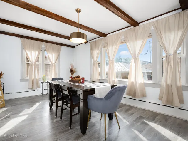 a view of a dining room with furniture window and outside view