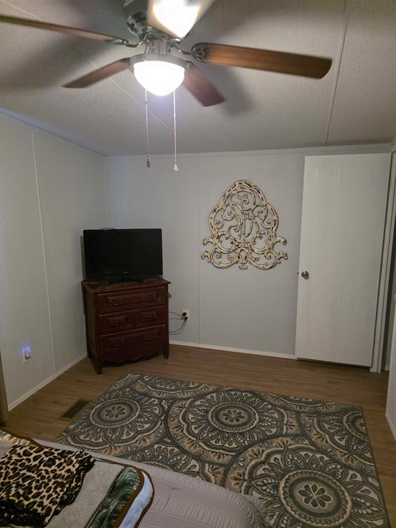 115 Yates Circle Aledo, TX 76008 - Photo 20 of 31 a living room with a couch and a flat screen tv