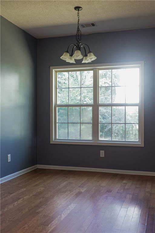 169 Rachel Boulevard Temple, GA 30179 - Photo 11 of 22 a view of an empty room with wooden floor and a window