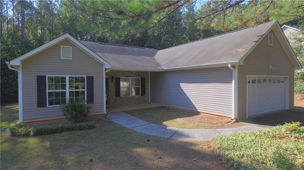169 Rachel Boulevard Temple, GA 30179 - Photo 2 of 22 a front view of a house with a yard and garage