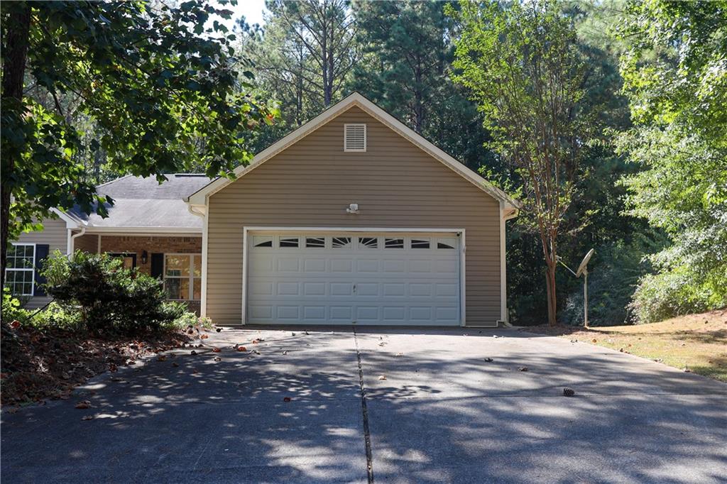 169 Rachel Boulevard Temple, GA 30179 - Photo 3 of 22 a front view of a house with a yard and garage