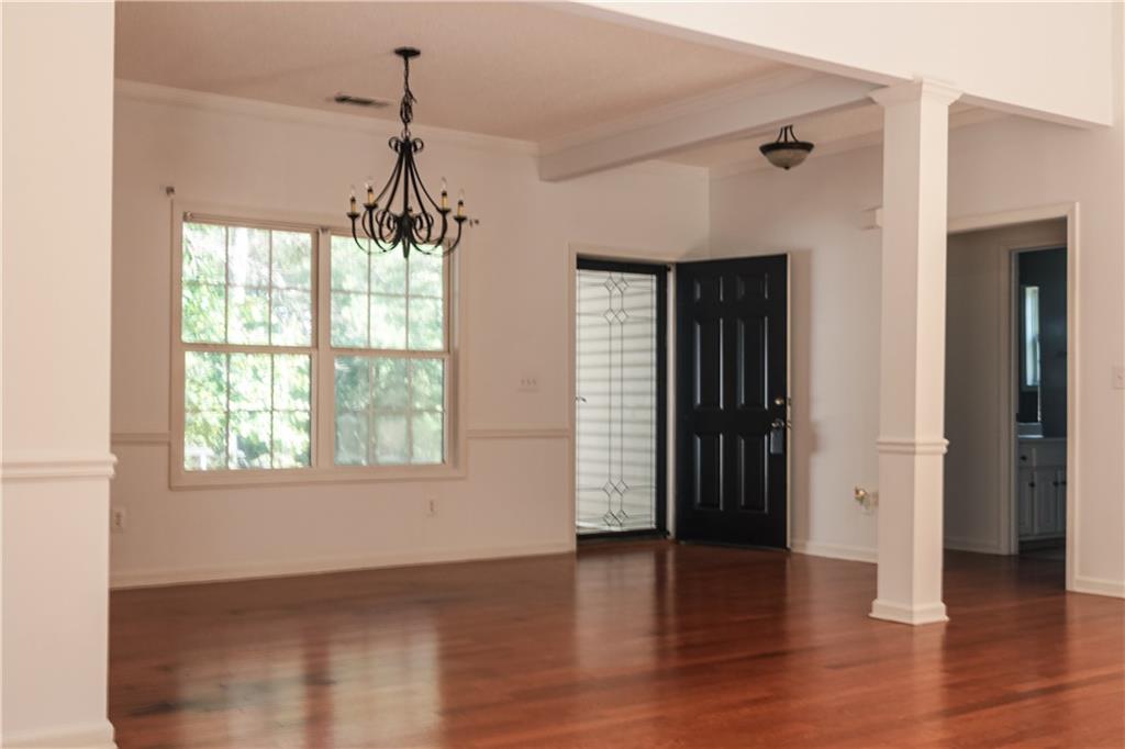 169 Rachel Boulevard Temple, GA 30179 - Photo 6 of 22 a view of a room with wooden floor and windows