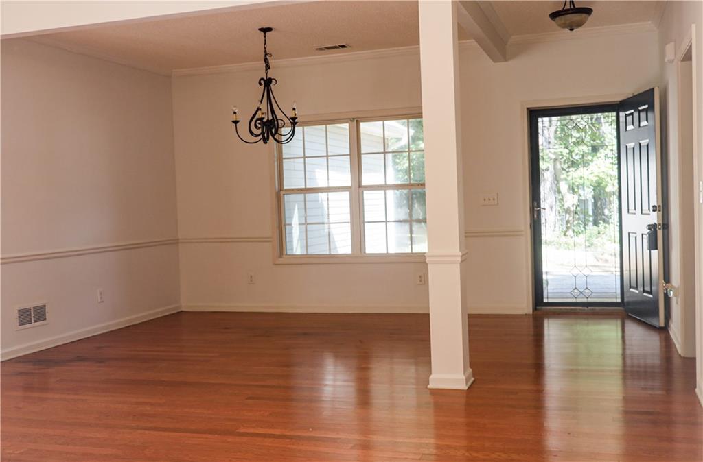 169 Rachel Boulevard Temple, GA 30179 - Photo 7 of 22 a view of empty room with wooden floor and fan