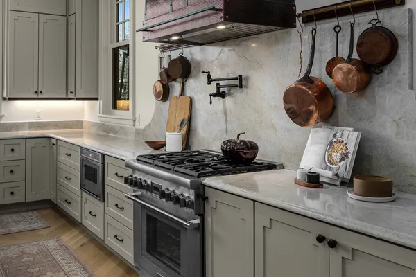 a bathroom with a double vanity sink a toilet and a mirror