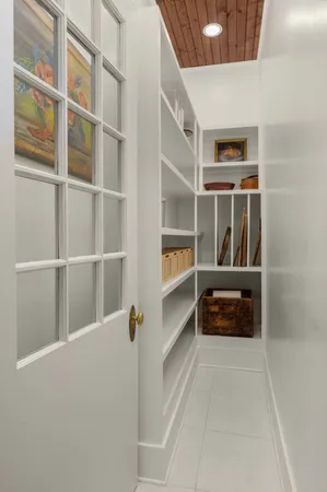 a bedroom with a bed lamp and a window