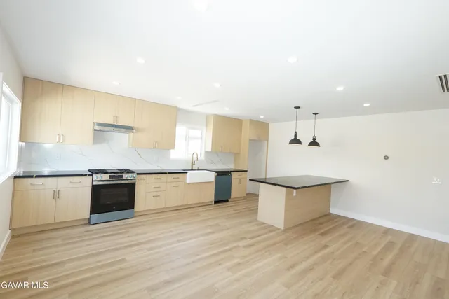 a view of hallway with wooden floor
