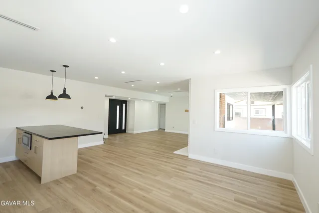 wooden floor in a hall with an entryway