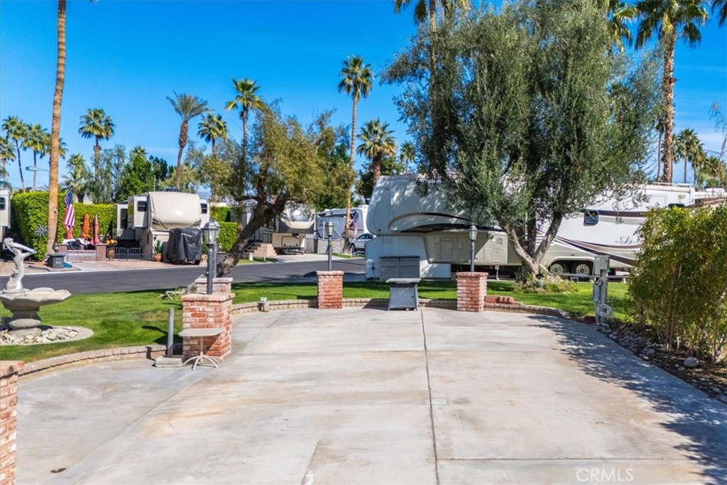 69411 Ramon Road Cathedral City, CA 92234 - Photo 2 of 17 a view of a park with swings and slides