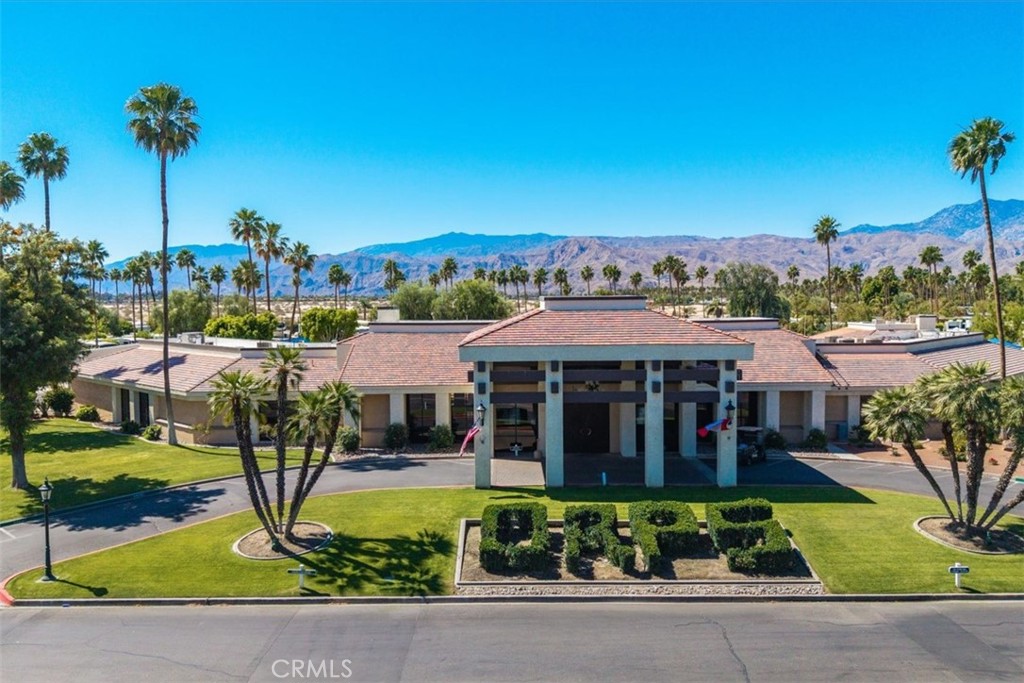 69411 Ramon Road Cathedral City, CA 92234 - Photo 10 of 17 a view of a house with a yard and potted plants