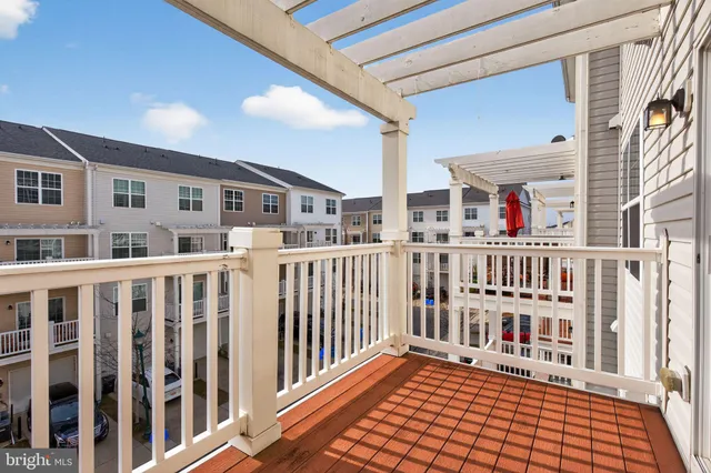 a porch with a bench in front of it