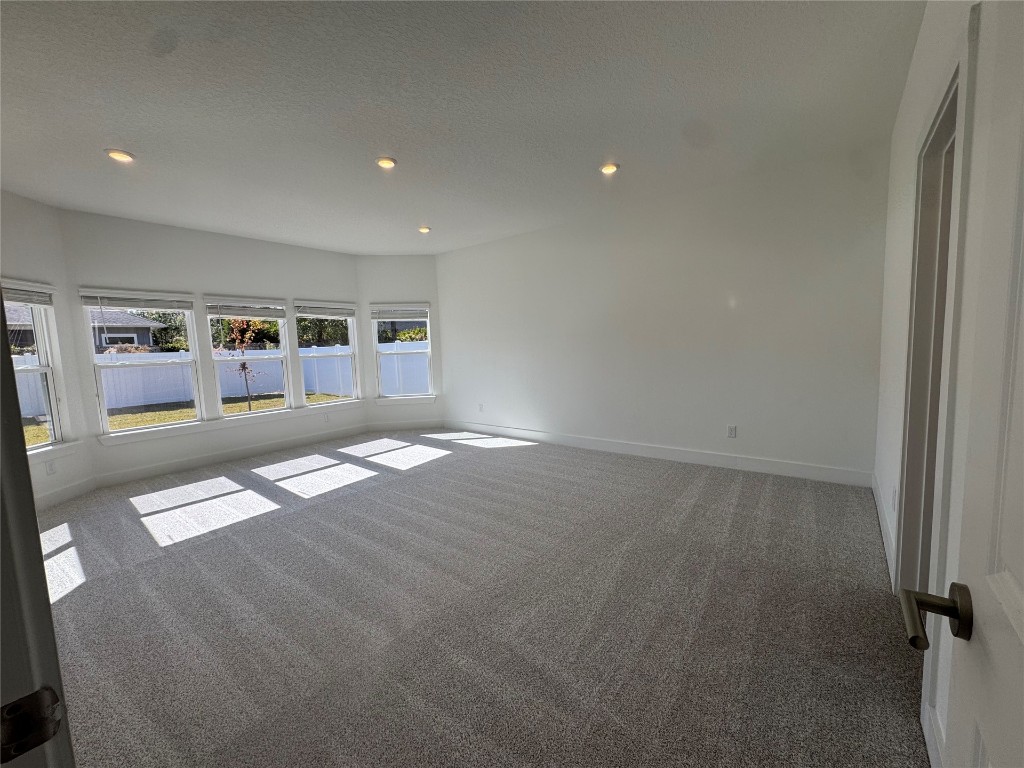 96040 Pirates Bluff Road Yulee, FL 32097 - Photo 6 of 10 an empty room with shelves and view of kitchen
