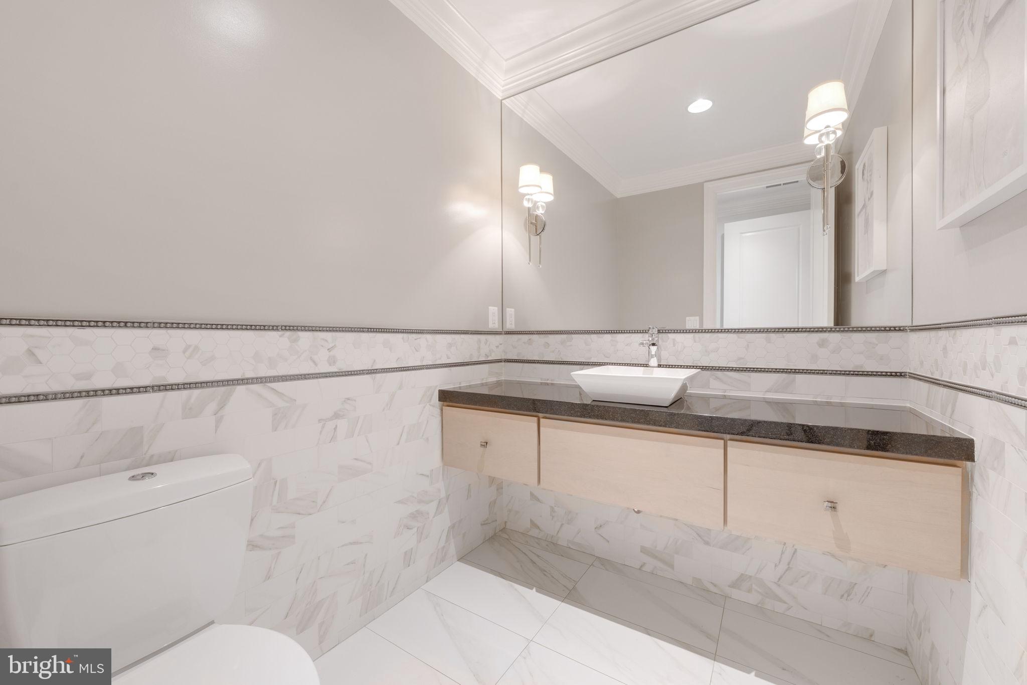 8505 Rayburn Road Bethesda, MD 20817 - Photo 15 of 49 a bathroom with a sink and a toilet