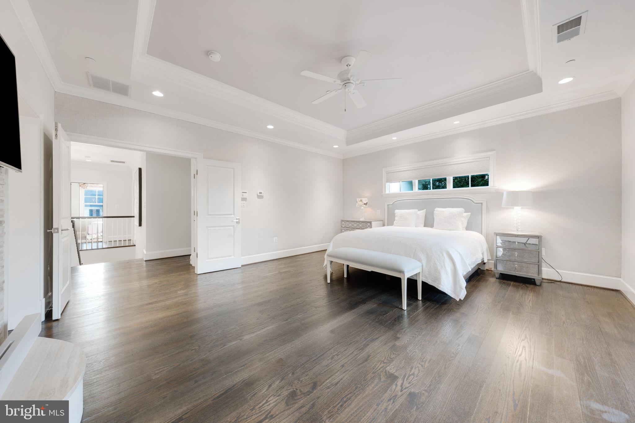 8505 Rayburn Road Bethesda, MD 20817 - Photo 22 of 49 a spacious bedroom with a bed and a wooden floor