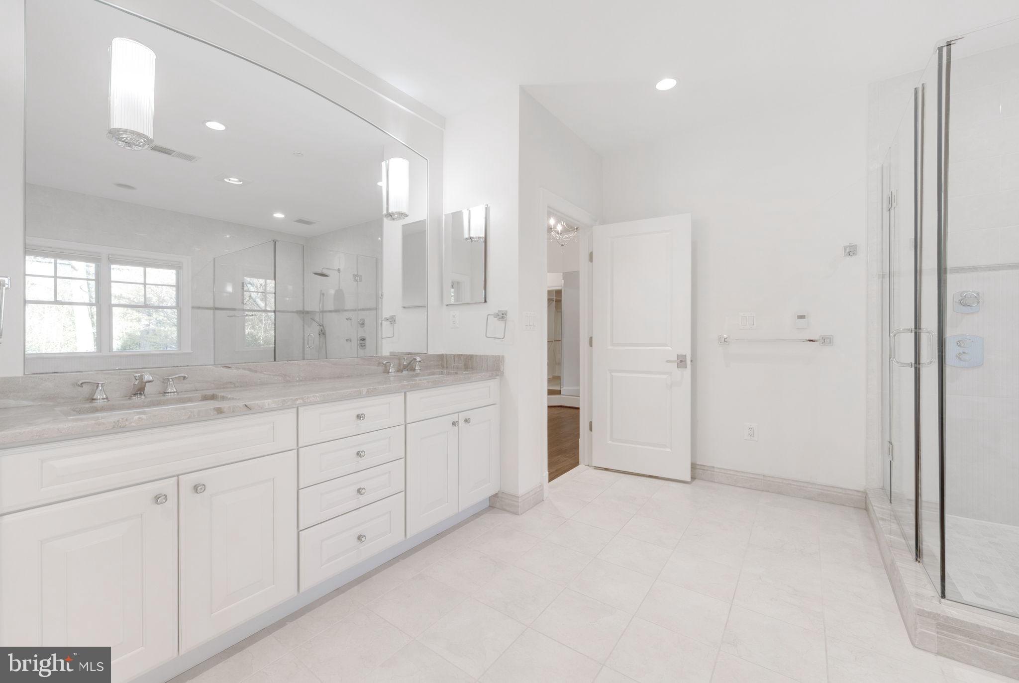 8505 Rayburn Road Bethesda, MD 20817 - Photo 24 of 49 a bathroom with a granite countertop sink mirror and double