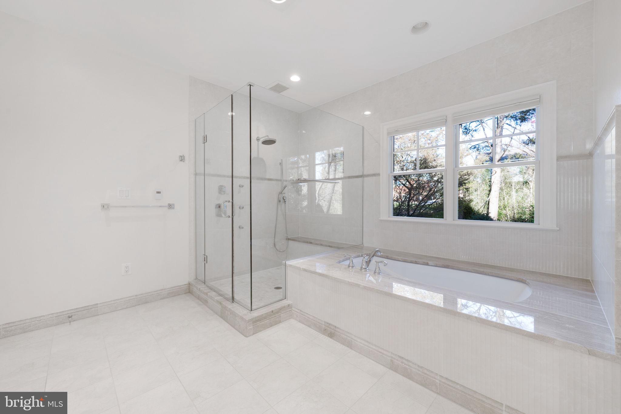 8505 Rayburn Road Bethesda, MD 20817 - Photo 26 of 49 a spacious bathroom with a bathtub and a shower