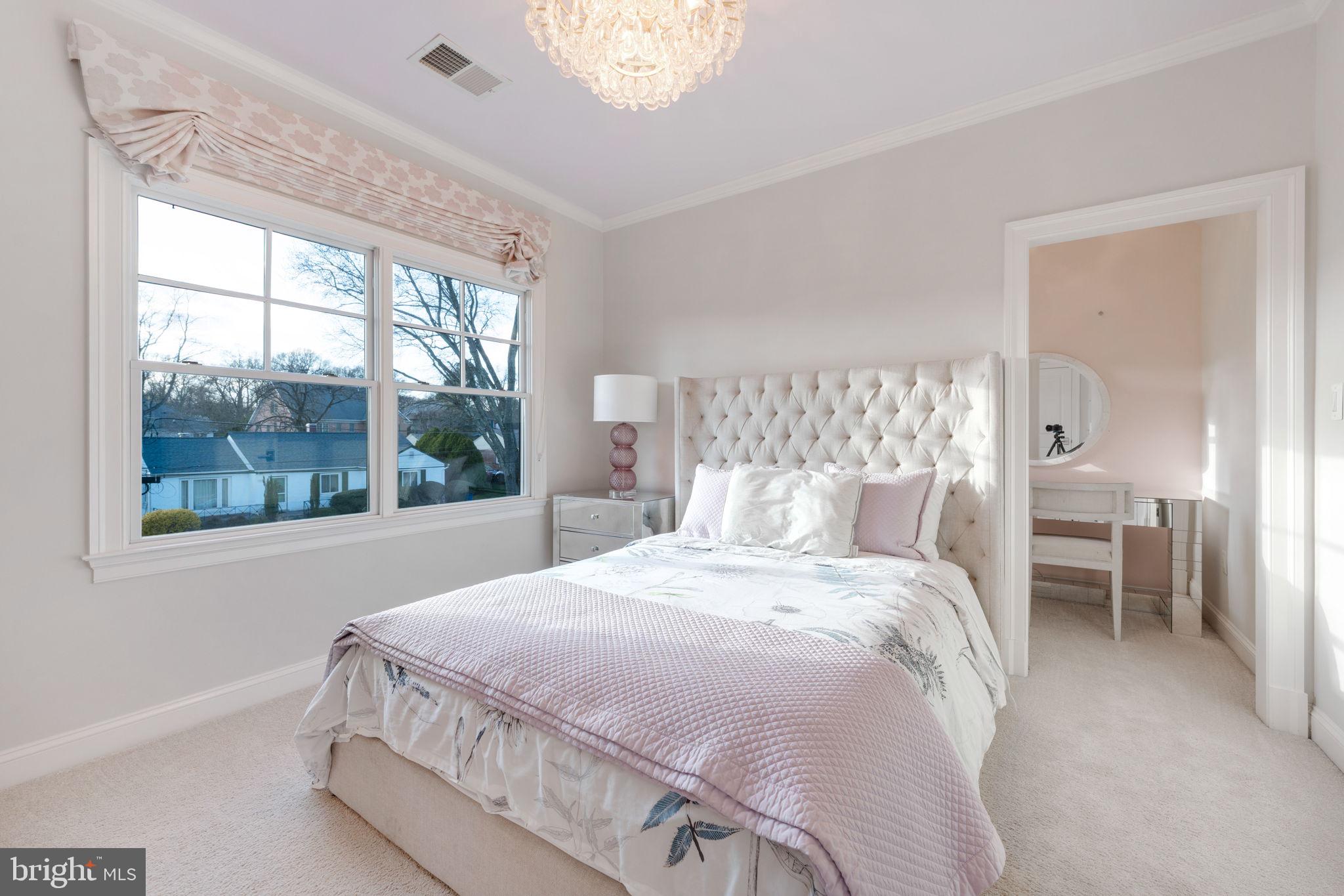 8505 Rayburn Road Bethesda, MD 20817 - Photo 32 of 49 a bedroom with a large bed and a large window