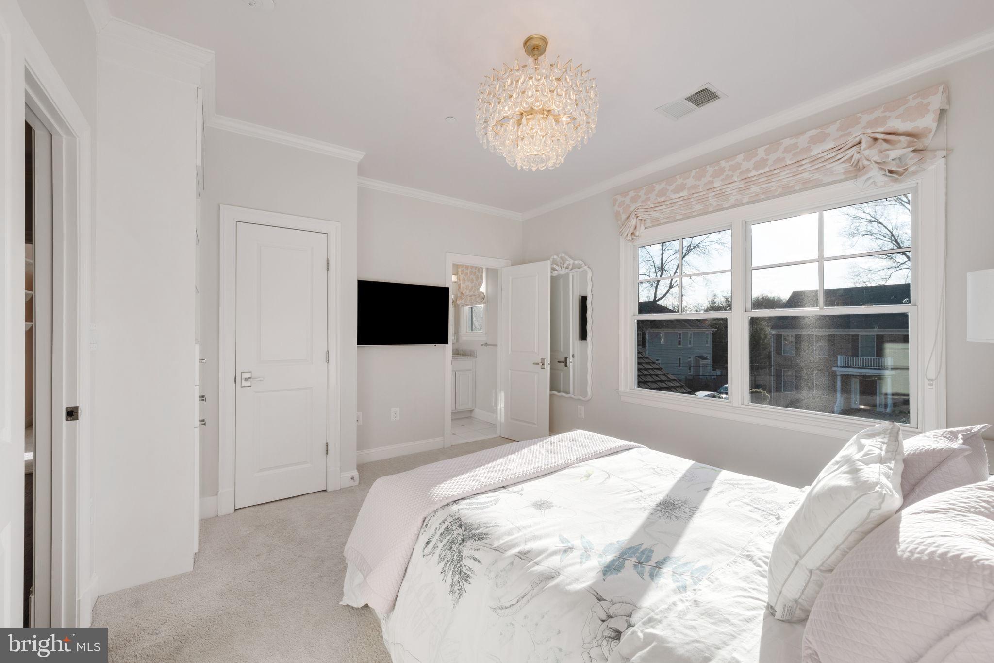 8505 Rayburn Road Bethesda, MD 20817 - Photo 33 of 49 a bedroom with a bed and a large window